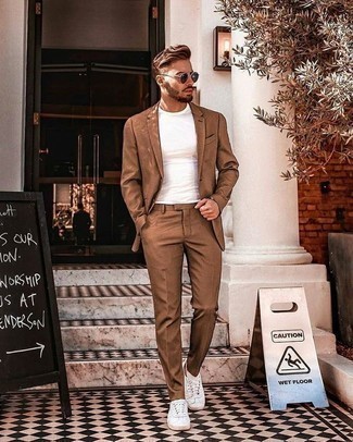 Beige Suit Smart Casual Outfits: Prove that no-one does smart menswear like you by opting for a beige suit and a white crew-neck t-shirt. Balance this ensemble with more laid-back shoes, like these white canvas low top sneakers.