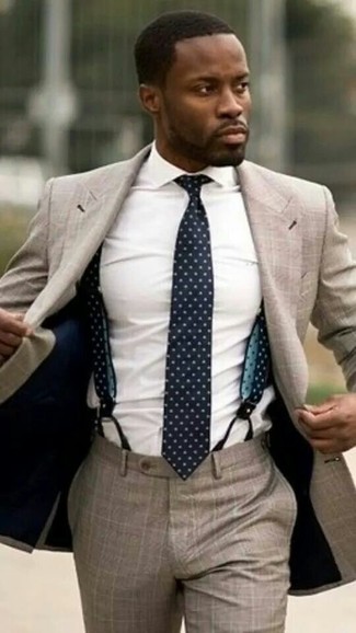 Navy and White Suspenders Outfits: A tan suit and navy and white suspenders are true menswear must-haves if you're crafting an off-duty wardrobe that holds to the highest sartorial standards.