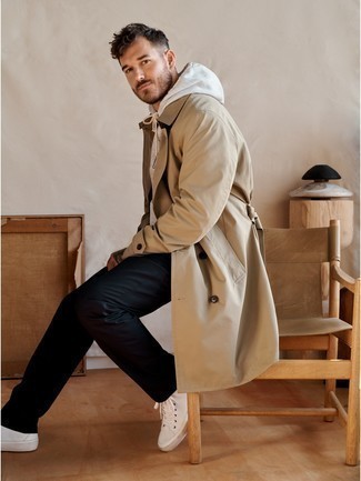 Tan Trenchcoat Outfits For Men: For something on the smart casual end, wear a tan trenchcoat and black chinos. A pair of white canvas high top sneakers adds a more dressed-down aesthetic to the ensemble.