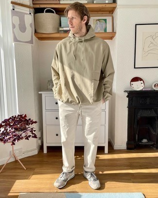 Tan Windbreaker Outfits For Men: This combo of a tan windbreaker and white chinos makes for the ultimate laid-back ensemble for today's gentleman. Add a carefree feel to your look by wearing beige athletic shoes.
