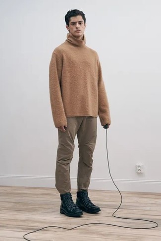 Beige Turtleneck Outfits For Men: This combo of a beige turtleneck and brown chinos combines comfort and practicality and helps you keep it clean yet contemporary. Take a more laid-back approach with footwear and complete this outfit with a pair of black leather work boots.