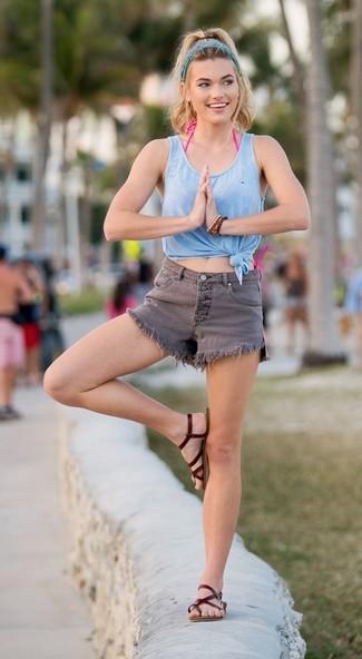 Light Blue Tank Outfits For Women: This casual combination of a light blue tank and grey denim shorts is a solid bet when you need to look cool but have zero time to dress up. Complement this outfit with dark brown leather thong sandals to avoid looking overdressed.