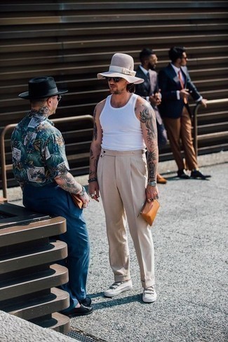 Wool Hat Outfits For Men: A white tank and a wool hat are a nice pairing to add to your daily styling repertoire. Beige canvas low top sneakers will instantly polish up even the simplest of outfits.