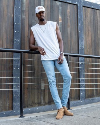 White Tank Outfits For Men: Why not make a white tank and light blue skinny jeans your outfit choice? Both of these items are super practical and look nice when married together. If you wish to instantly spruce up your ensemble with a pair of shoes, why not introduce tan suede chelsea boots to the equation?