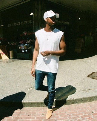 White and Black Print Baseball Cap Outfits For Men: Indisputable proof that a white tank and a white and black print baseball cap are amazing when married together in a casual outfit. Complete this outfit with beige suede chelsea boots to make the ensemble a bit more elegant.