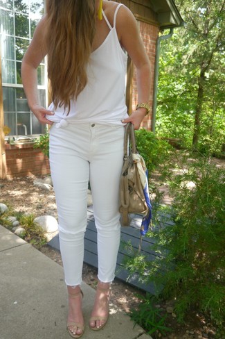 White Ripped Skinny Jeans Outfits: A white tank and white ripped skinny jeans worn together are a total eye candy for those dressers who prefer relaxed styles. For something more on the classy side to finish off this getup, complete your look with a pair of beige leather heeled sandals.