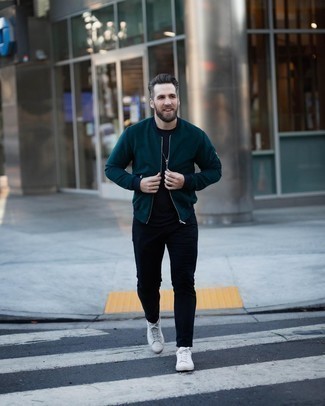 Teal Bomber Jacket Outfits For Men: Make a teal bomber jacket and navy jeans your outfit choice for a casually cool and trendy look. Introduce white leather low top sneakers to the mix and the whole ensemble will come together.