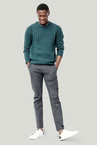 Dark Green Cable Sweater Outfits For Men: A dark green cable sweater and grey chinos are the kind of a fail-safe off-duty ensemble that you need when you have no time. You can take a more casual route with footwear by sporting white and navy canvas low top sneakers.