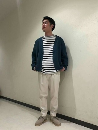 Cardigan Outfits For Men: Fashionable and comfortable, this casual combo of a cardigan and beige chinos offers endless styling possibilities. On the footwear front, this look pairs wonderfully with tan suede desert boots.
