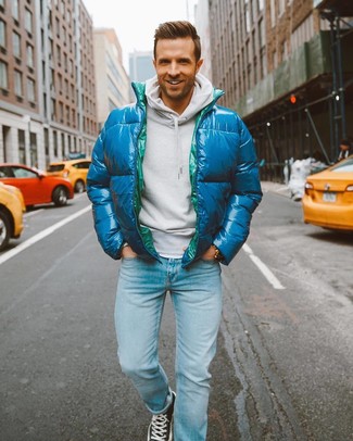 Olive Puffer Jacket Outfits For Men: Pair an olive puffer jacket with light blue jeans to don a dressy, but not too dressy look. For something more on the daring side to finish this getup, add black canvas high top sneakers to the mix.