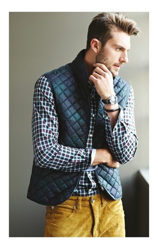 Olive Quilted Gilet Outfits For Men: This combo of an olive quilted gilet and mustard corduroy jeans is super versatile and creates instant appeal.