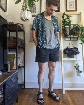 Black Canvas Sandals Outfits For Men: Opt for a teal print short sleeve shirt and black shorts to feel completely confident in yourself and look casually cool. Black canvas sandals will give a dose of stylish casualness to an otherwise mostly dressed-up ensemble.
