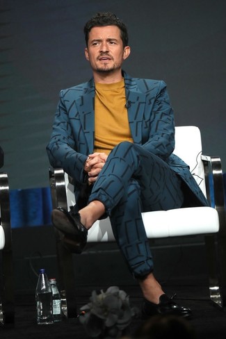 Orlando Bloom wearing Teal Suit, Mustard Crew-neck Sweater, Black Leather Tassel Loafers