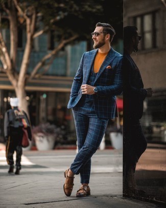 Navy Check Three Piece Suit Outfits: For an outfit that's effortlessly sleek and wow-worthy, pair a navy check three piece suit with an orange crew-neck t-shirt. To introduce a bit of depth to this outfit, complement this outfit with brown leather double monks.