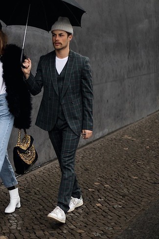 Dark Green Check Three Piece Suit Outfits: Putting together a dark green check three piece suit with a white crew-neck t-shirt is a great choice for a casually neat outfit. White and green leather low top sneakers are a fail-safe way to give a dose of stylish effortlessness to your look.