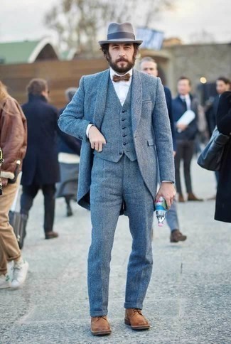 Grey Wool Hat Outfits For Men: This sharp ensemble is really pared down: a blue three piece suit and a grey wool hat. A nice pair of brown leather brogue boots is an easy way to transform your getup.
