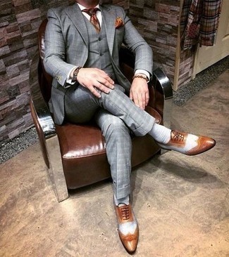 Brown Bracelet Outfits For Men: A grey plaid three piece suit and a brown bracelet are the ideal way to introduce extra cool into your day-to-day off-duty wardrobe. You could perhaps get a bit experimental with footwear and introduce a pair of tobacco leather brogues to the equation.