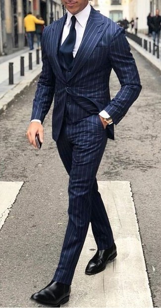 Navy Three Piece Suit Outfits: Marrying a navy three piece suit and a white dress shirt is a guaranteed way to breathe style into your styling collection. A nice pair of black leather chelsea boots is an effortless way to bring a sense of stylish effortlessness to this ensemble.