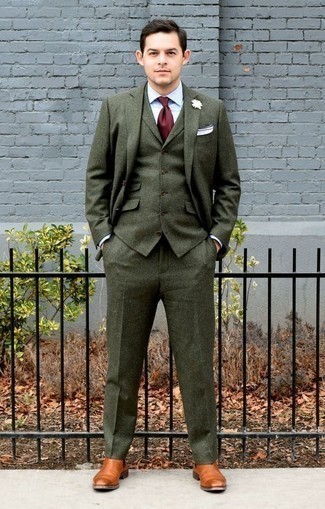 Dark Green Suit Outfits: This elegant combination of a dark green suit and a light blue dress shirt will cement your styling chops. If you wish to easily dress down your outfit with a pair of shoes, why not complete this look with a pair of tobacco leather chelsea boots?