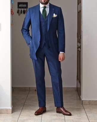 Dark Green Tie Outfits For Men: Loving how this pairing of a navy three piece suit and a dark green tie instantly makes any gentleman look polished and smart. Dark brown leather chelsea boots will give a sense of stylish effortlessness to an otherwise classic look.
