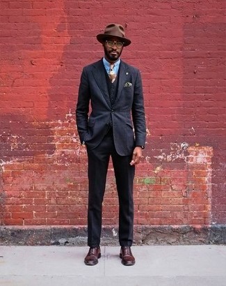 Dark Brown Wool Hat Outfits For Men: You'll be amazed at how easy it is for any guy to throw together this laid-back outfit. Just a black three piece suit and a dark brown wool hat. For a dressier vibe, complement this look with a pair of burgundy leather derby shoes.