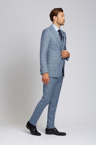 Light Blue Plaid Three Piece Suit Outfits: Pair a light blue plaid three piece suit with a light blue dress shirt and you'll be the picture of sophistication. Serve a little mix-and-match magic by slipping into a pair of black leather derby shoes.