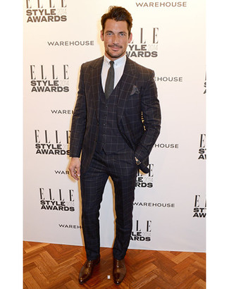 David Gandy wearing Black Check Three Piece Suit, White Dress Shirt, Brown Leather Derby Shoes, Charcoal Tie