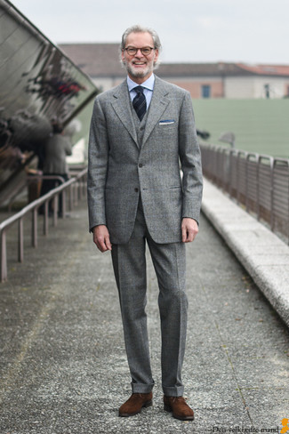 Grey Plaid Three Piece Suit Outfits: Consider teaming a grey plaid three piece suit with a light blue vertical striped dress shirt for seriously smart style. For extra style points, complement this ensemble with a pair of brown suede derby shoes.