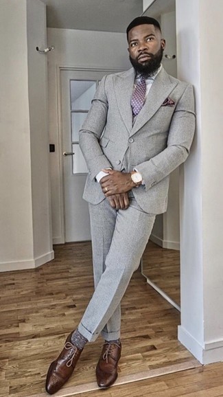 Three Piece Suit Outfits: Irrefutable proof that a three piece suit and a white dress shirt look awesome if you pair them together in a polished look for today's guy. A pair of dark brown leather derby shoes adds more depth to your outfit.