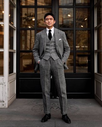 Grey Wool Suit Spring Outfits: Reach for a grey wool suit and a white dress shirt and you're bound to make an entrance. Send this getup in a less formal direction by wearing black leather derby shoes. Keep this getup in your front hall closet when spring arrives, and we promise you'll save time getting ready on more than one morning.