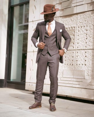 Three Piece Suit Outfits: Wear a three piece suit and a white dress shirt and you'll be the picture of class. Want to play it down in the shoe department? Complement your ensemble with dark brown leather derby shoes for the day.