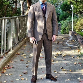 Dark Brown Wool Suit Outfits: Pairing a dark brown wool suit with a light blue dress shirt is an on-point idea for a classic and classy getup. Finishing with dark brown suede desert boots is a guaranteed way to inject a more relaxed spin into your look.