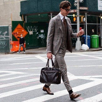 Tobacco Leather Briefcase Outfits: This laid-back pairing of a brown plaid three piece suit and a tobacco leather briefcase is a never-failing option when you need to look great in a flash. Serve a little outfit-mixing magic by finishing with a pair of brown leather double monks.