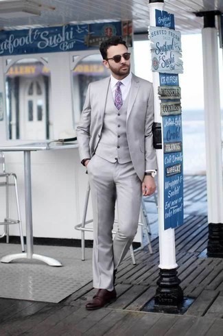 Grey Three Piece Suit Outfits: Putting together a grey three piece suit and a white dress shirt is a guaranteed way to inject your closet with some masculine elegance. Burgundy leather double monks add a new flavor to an otherwise mostly dressed-up ensemble.