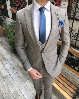 Grey Three Piece Suit Outfits: You'll be surprised at how easy it is to throw together this refined outfit. Just a grey three piece suit matched with a white dress shirt. A pair of brown leather double monks introduces a laid-back aesthetic to the ensemble.
