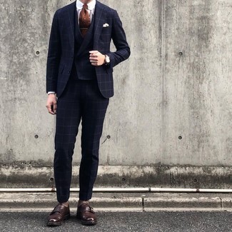 Brown Print Tie Outfits For Men: A modern gent's refined collection should always include such mainstays as a navy check three piece suit and a brown print tie. A pair of dark brown leather double monks immediately turns up the appeal of your look.