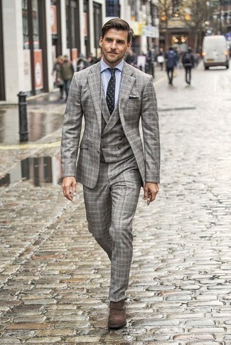 Grey Plaid Three Piece Suit Outfits: A grey plaid three piece suit and a light blue dress shirt are a classy look that every modern gentleman should have in his closet. Want to play it down on the shoe front? Complement this outfit with dark brown suede double monks for the day.