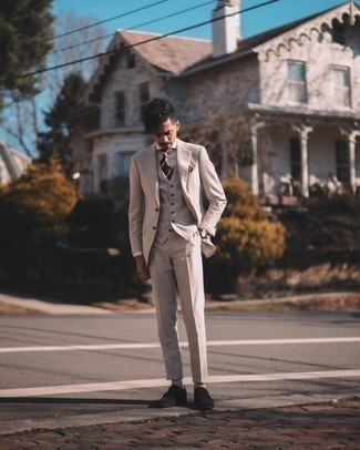 Beige Three Piece Suit Outfits: For a look that's sophisticated and gasp-worthy, wear a beige three piece suit with a grey vertical striped dress shirt. For something more on the daring side to finish your getup, complement this getup with dark brown suede double monks.