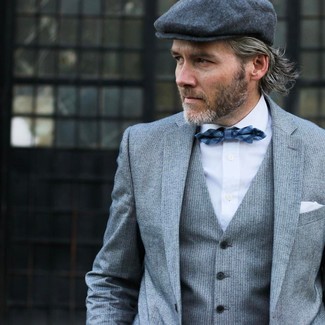 Charcoal Flat Cap Outfits For Men: A grey vertical striped three piece suit and a charcoal flat cap are the kind of off-duty essentials that you can style a ton of ways.