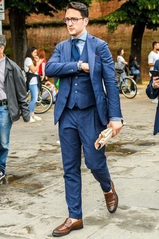 Brown Leather Loafers Outfits For Men: Pairing a navy check three piece suit and a light blue chambray dress shirt is a fail-safe way to inject manly refinement into your styling repertoire. To inject an easy-going vibe into this look, add brown leather loafers to the equation.