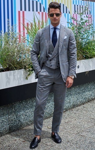 Charcoal Check Suit Outfits: To look like a stylish gentleman, rock a charcoal check suit with a light blue dress shirt. For extra style points, add a pair of black leather loafers to the mix.