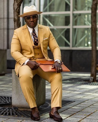 Orange Leather Zip Pouch Outfits For Men: For a laid-back look, team a yellow three piece suit with an orange leather zip pouch — these two items work nicely together. Our favorite of an infinite number of ways to complement this outfit is with brown print leather loafers.