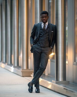 Grey Three Piece Suit Outfits: Marrying a grey three piece suit and a white dress shirt is a fail-safe way to inject an elegant touch into your current arsenal. A pair of navy leather loafers effortlessly revs up the fashion factor of your look.