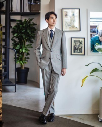 Grey Plaid Suit Outfits: Go for something sophisticated yet on-trend with a grey plaid suit and a white dress shirt. Add black leather loafers to your look and ta-da: the ensemble is complete.