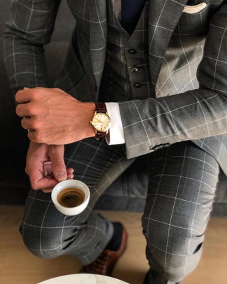 Grey Three Piece Suit Outfits: This ensemble clearly illustrates that it is totally worth investing in such elegant menswear pieces as a grey three piece suit and a white dress shirt. Let your sartorial savvy really shine by finishing off your getup with brown leather oxford shoes.