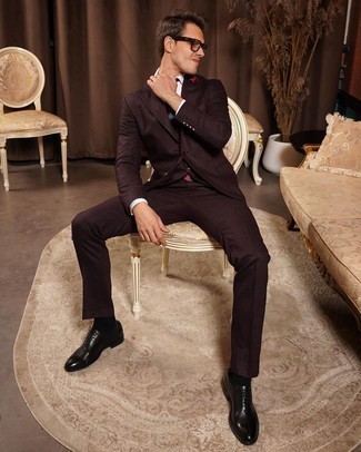 Burgundy Suit Outfits: This is hard proof that a burgundy suit and a white dress shirt are amazing when teamed together in a classy getup for a modern gentleman. We're loving how cohesive this outfit looks when rounded off with black leather oxford shoes.