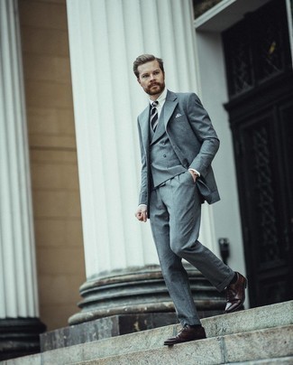 Grey Three Piece Suit Outfits: Swing into something classy and timeless with a grey three piece suit and a white dress shirt. Add a pair of dark brown leather oxford shoes to the equation et voila, the look is complete.