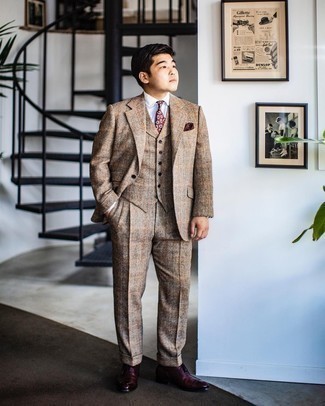 Tan Wool Three Piece Suit Outfits: Channel your inner Kingsman agent and try teaming a tan wool three piece suit with a light blue vertical striped dress shirt. Our favorite of a variety of ways to finish off this ensemble is burgundy leather oxford shoes.