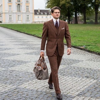 Bag Outfits For Men: For comfort dressing with a contemporary spin, team a brown check three piece suit with a bag. To give your ensemble a classier touch, introduce dark brown leather oxford shoes to the mix.