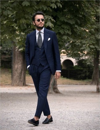 Charcoal Tie Outfits For Men: A modern gentleman's refined collection should always include such essentials as a navy three piece suit and a charcoal tie. Inject some casualness into your look with black leather tassel loafers.